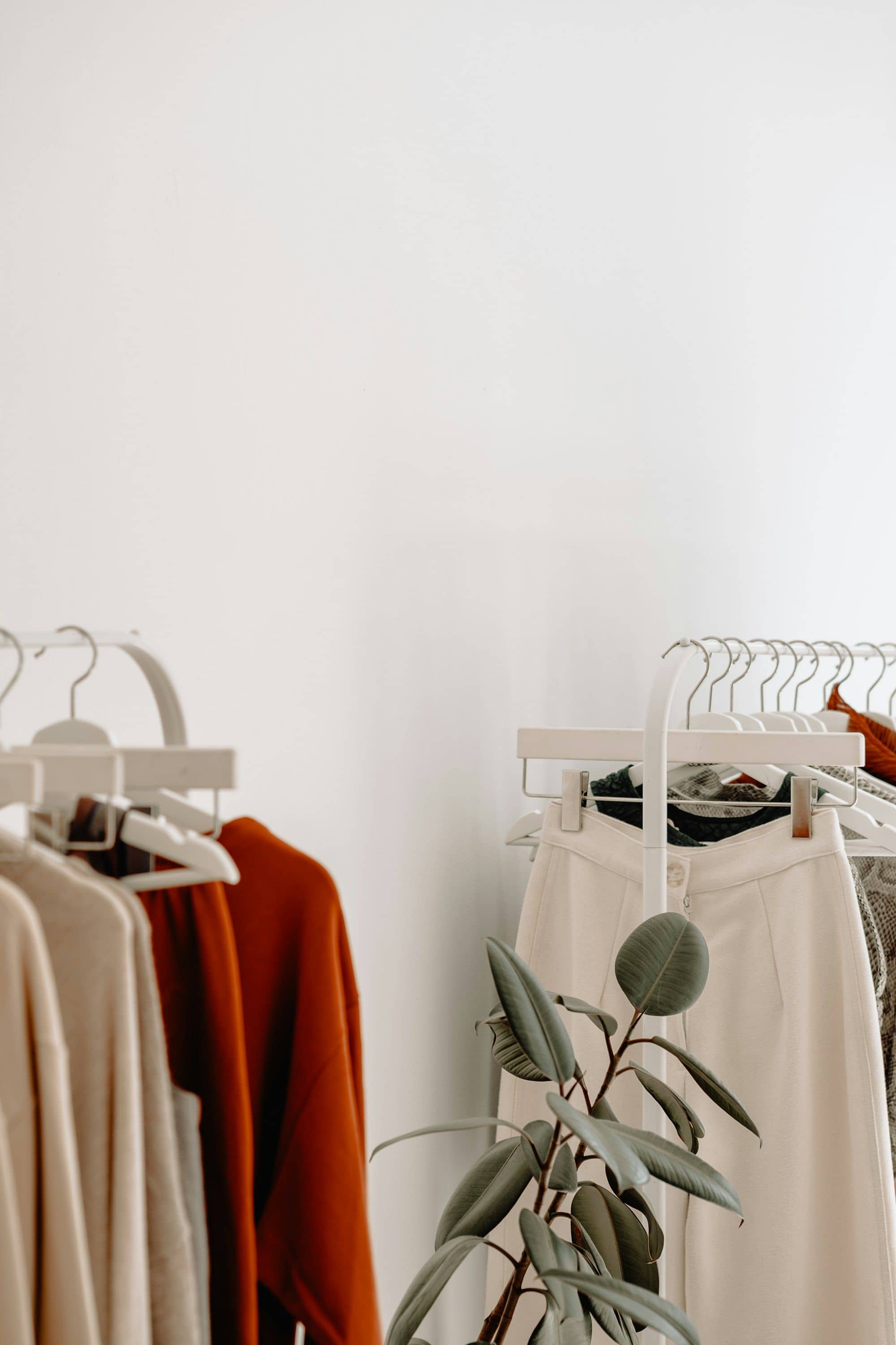 Clothing racks in a bright boutique.