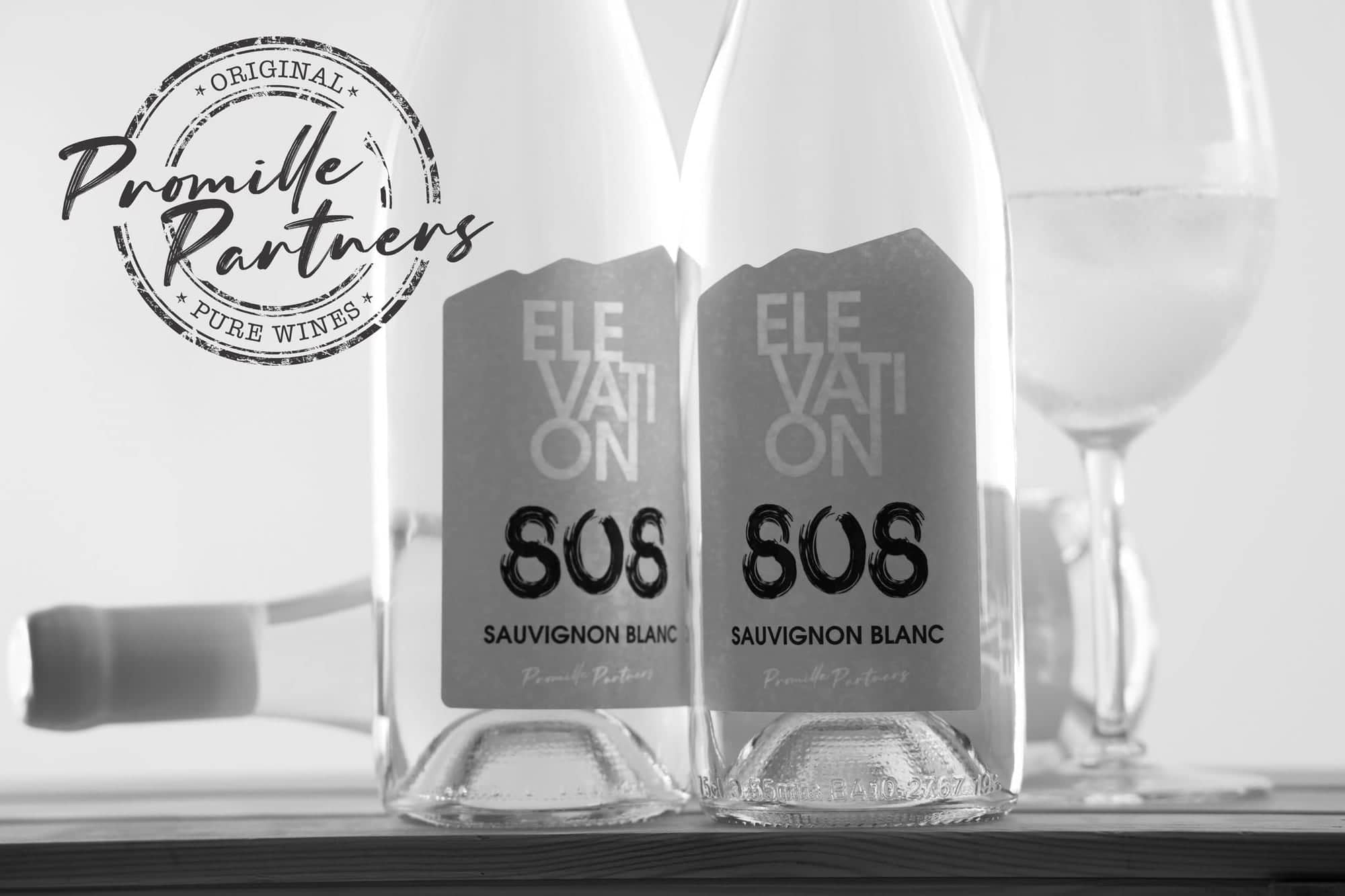 Black-and-white photo of two bottles of Elevation 808 Sauvignon Blanc with the Promille Partners “Original · Pure Wines” stamp.